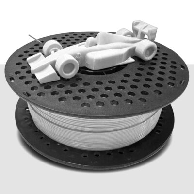 A small white toy race car on a perforated black spool.